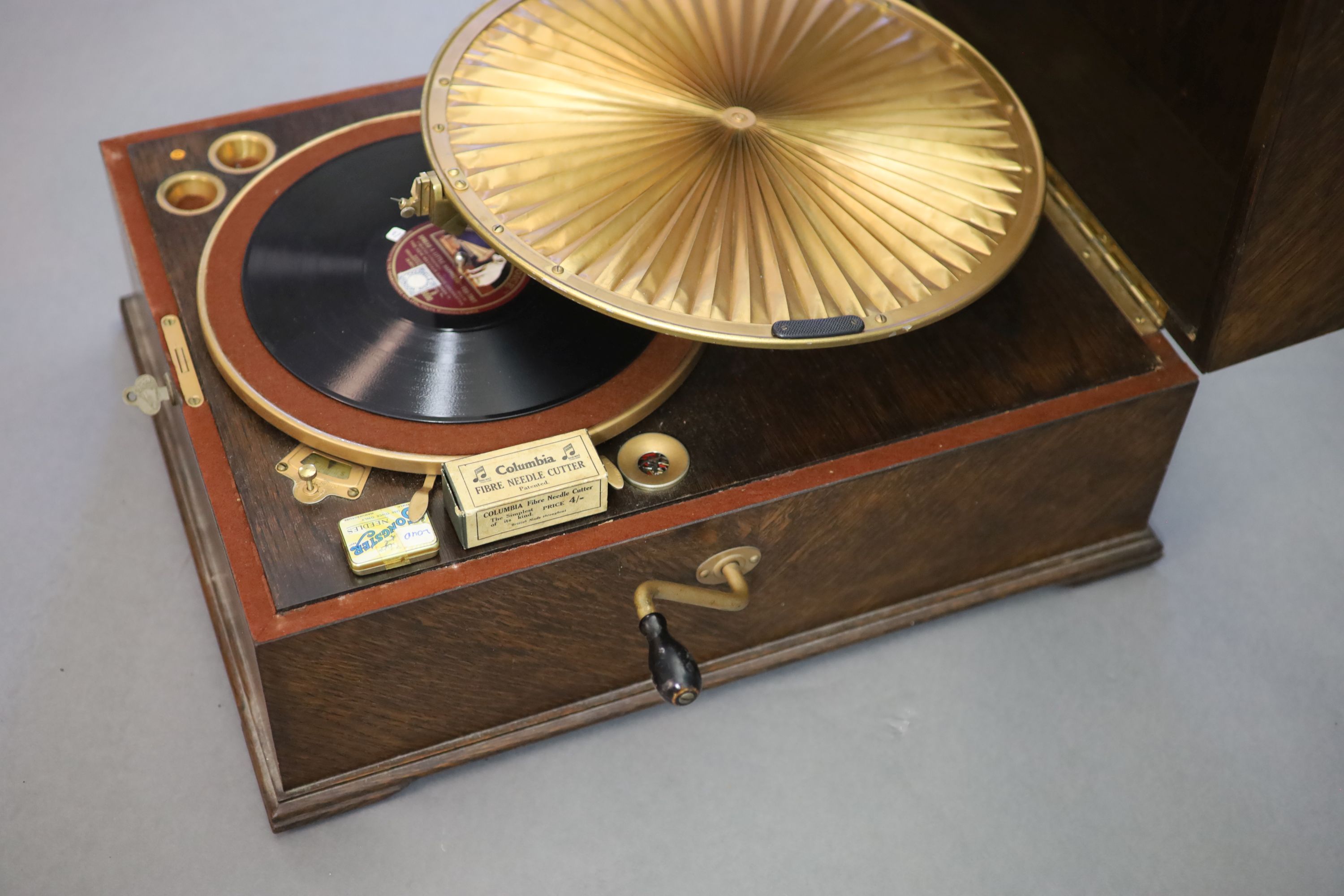 A HMV Lumiere model oak cased 460 gramophone, c1925, closed measurements 42cm wide, 55cm deep, 27cm high.